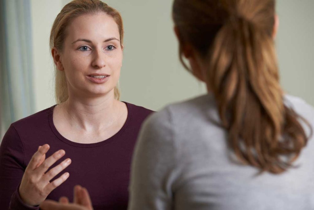 Effective speaking. Two women having a conversation